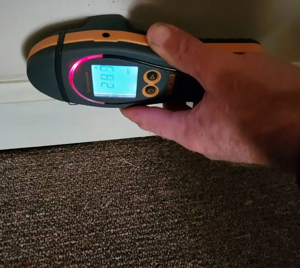 Moisture detection at baseboard during Burst Pipe Cleanup in Angier